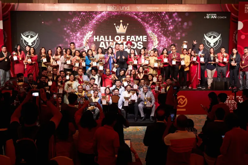 Siddharth Rajsekar on stage with students at the Internet Lifestyle Hub Hall of Fame Awards